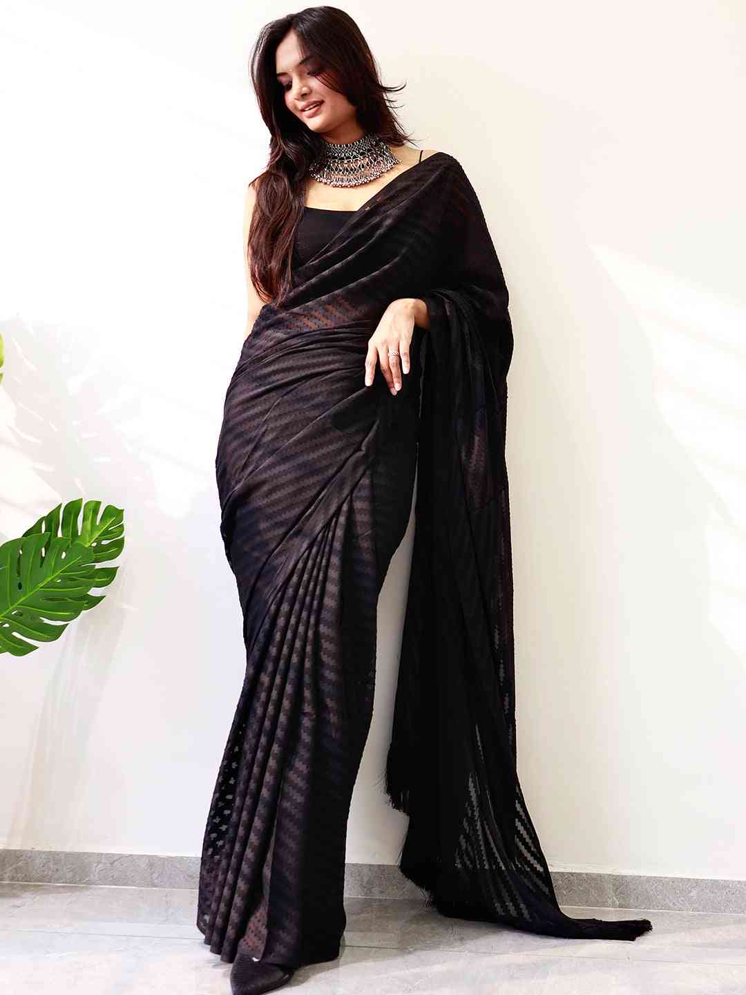 Elegant black georgette saree with thread weaving design