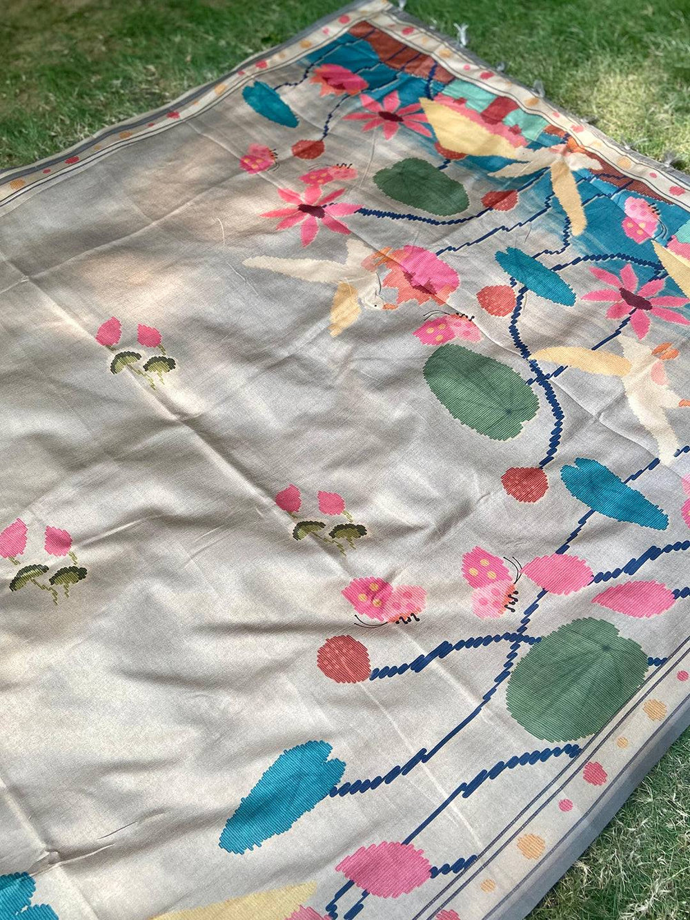 Spread view of Grey Tussar Silk Saree showcasing Ikkat Kalamkari design