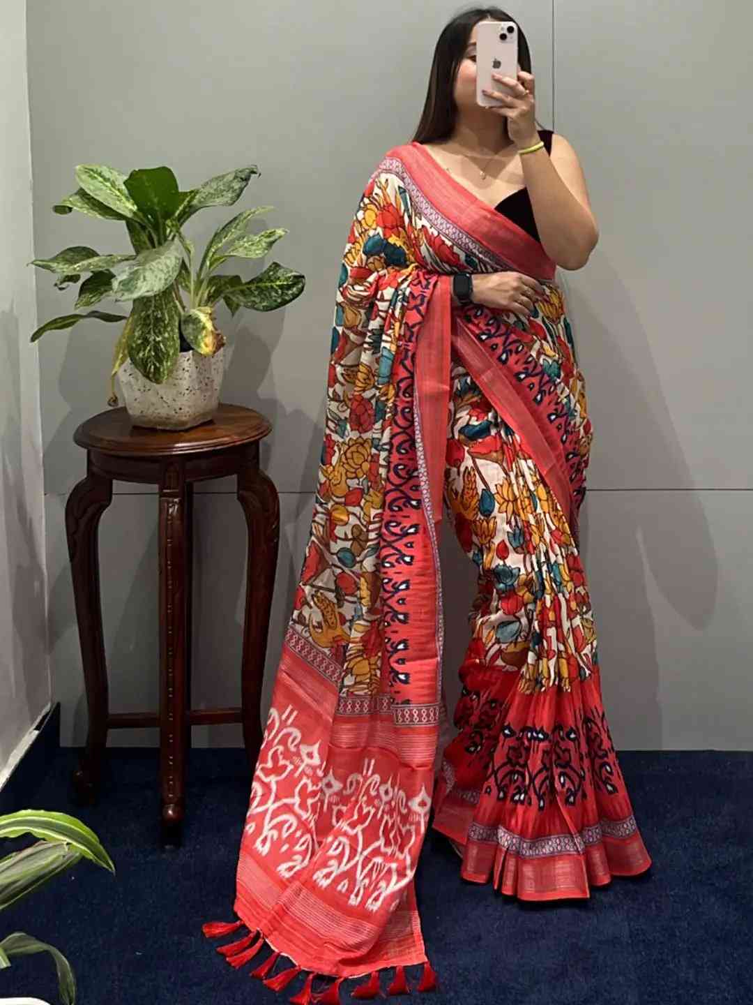 Floral Ikkat Saree displayed indoors with plant decor