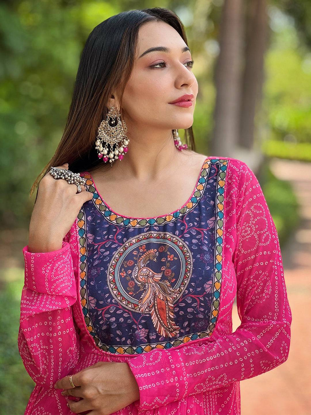 Close-up of deep pink dress with Pen Kalamkari Yog design.