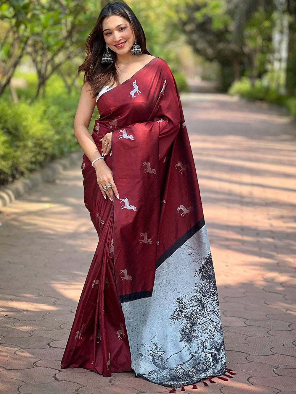 Elegant maroon soft silk saree with detailed zari pallu design