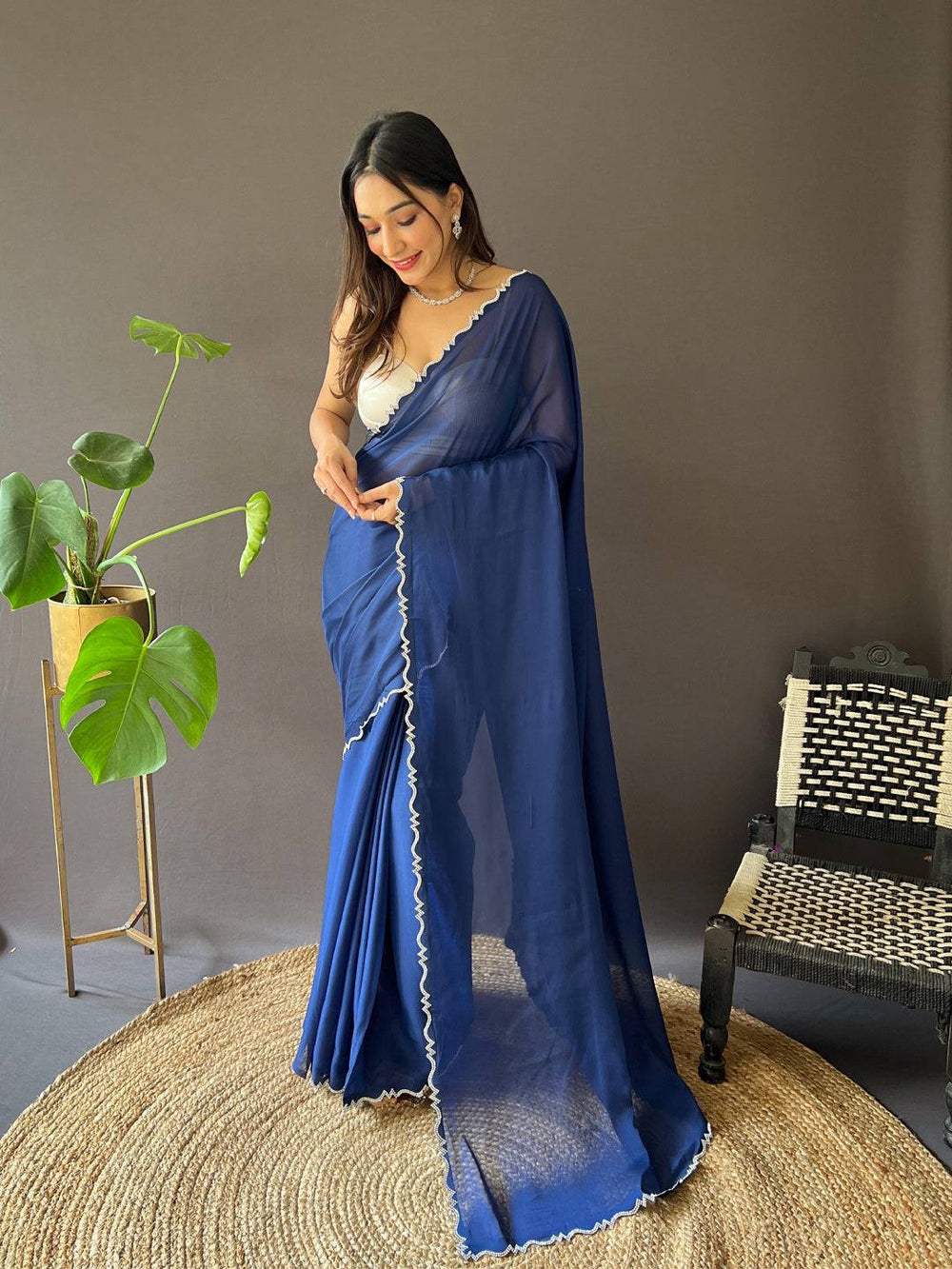 Elegant blue Rangoli silk saree with Zarkon cut work border