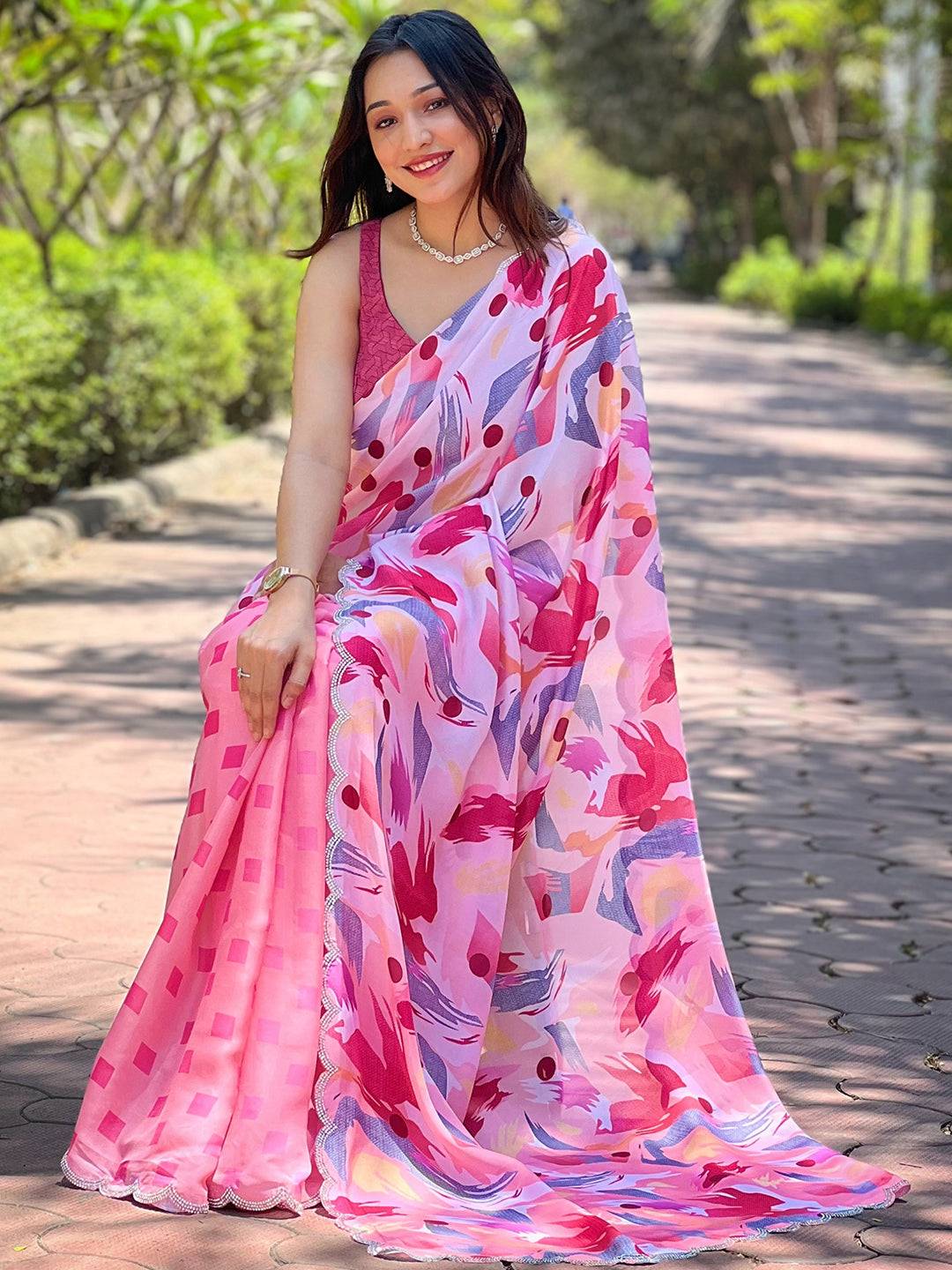Stylish Pink Batik and Polka Dots Print Saree, seated pose
