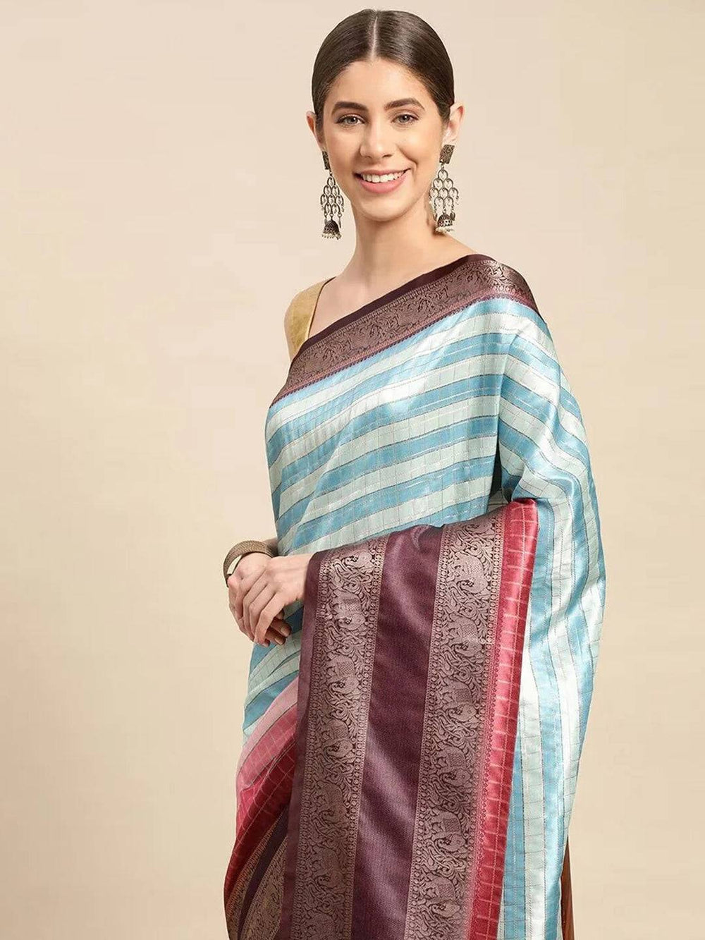 Model wearing blue striped Banarasi silk saree with maroon border
