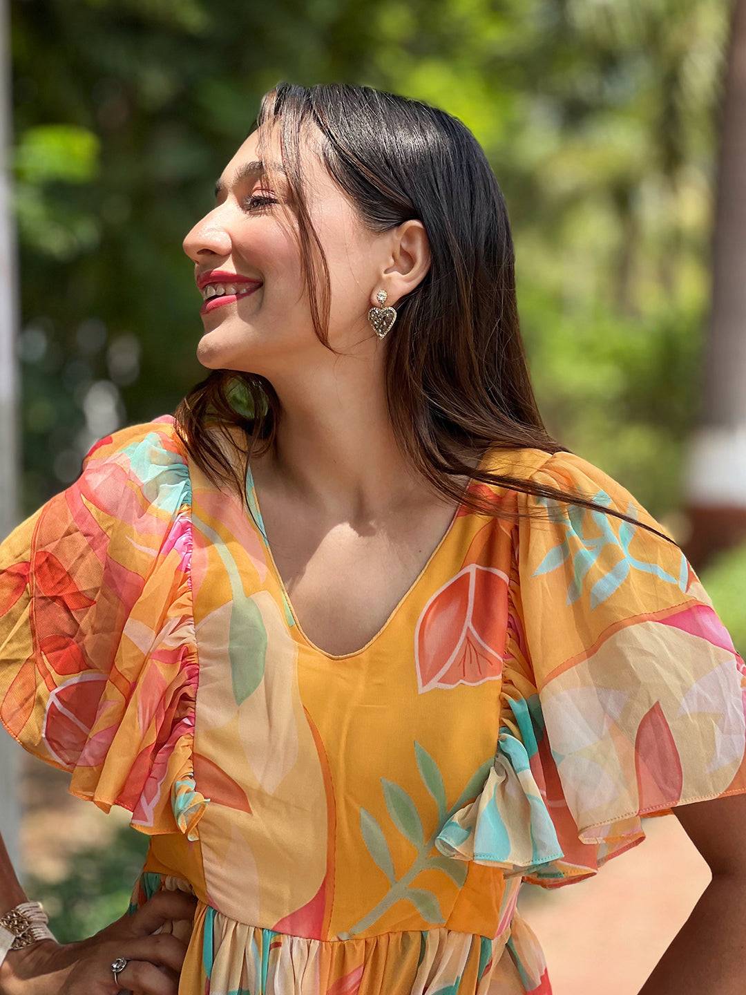 Smiling woman in Carnival Yellow V-Neck Dress