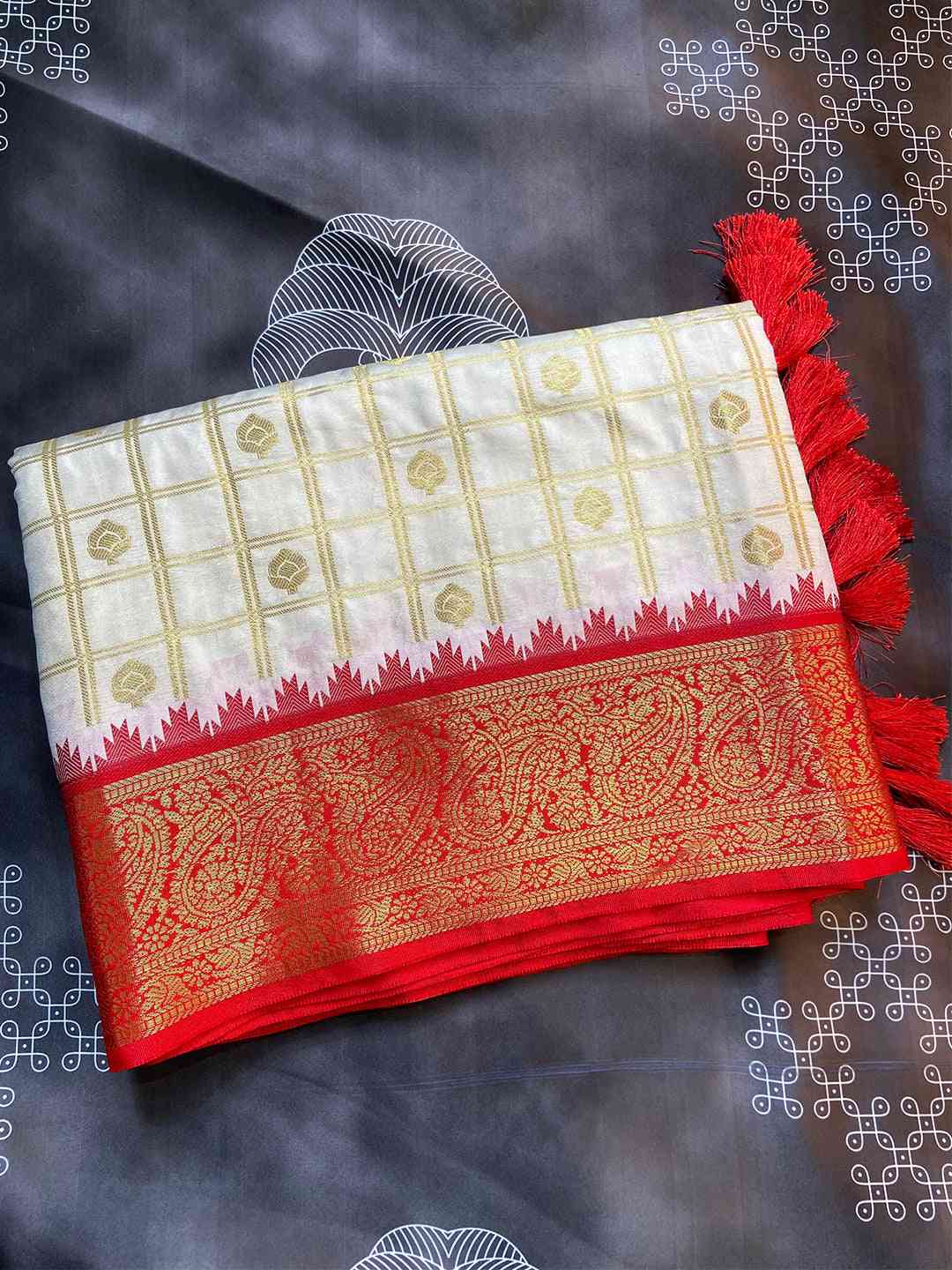 Folded Gadwal saree with detailed temple border