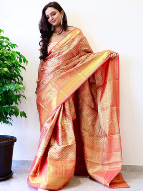 Elegant gold zari Kanjivaaram silk saree draped by model.
