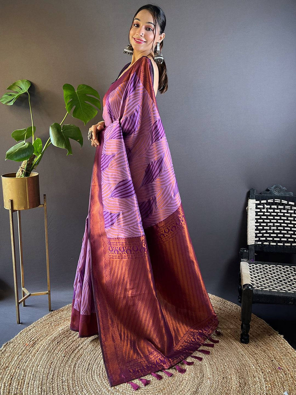 Side view of lavender tussar silk ikkat saree with intricate design