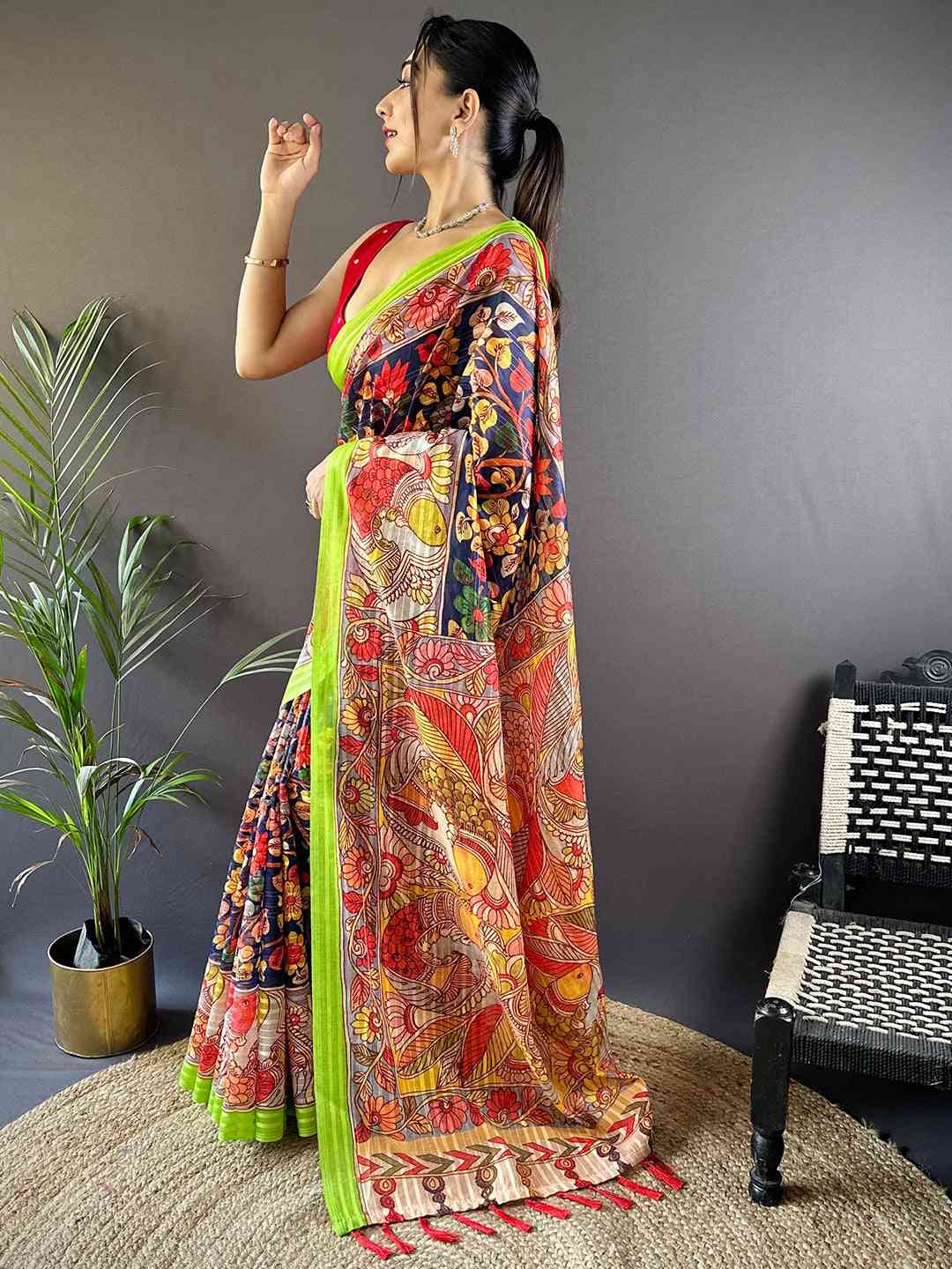 Side pose of model in Orchid Blue Pen Kalamkari Linen Saree