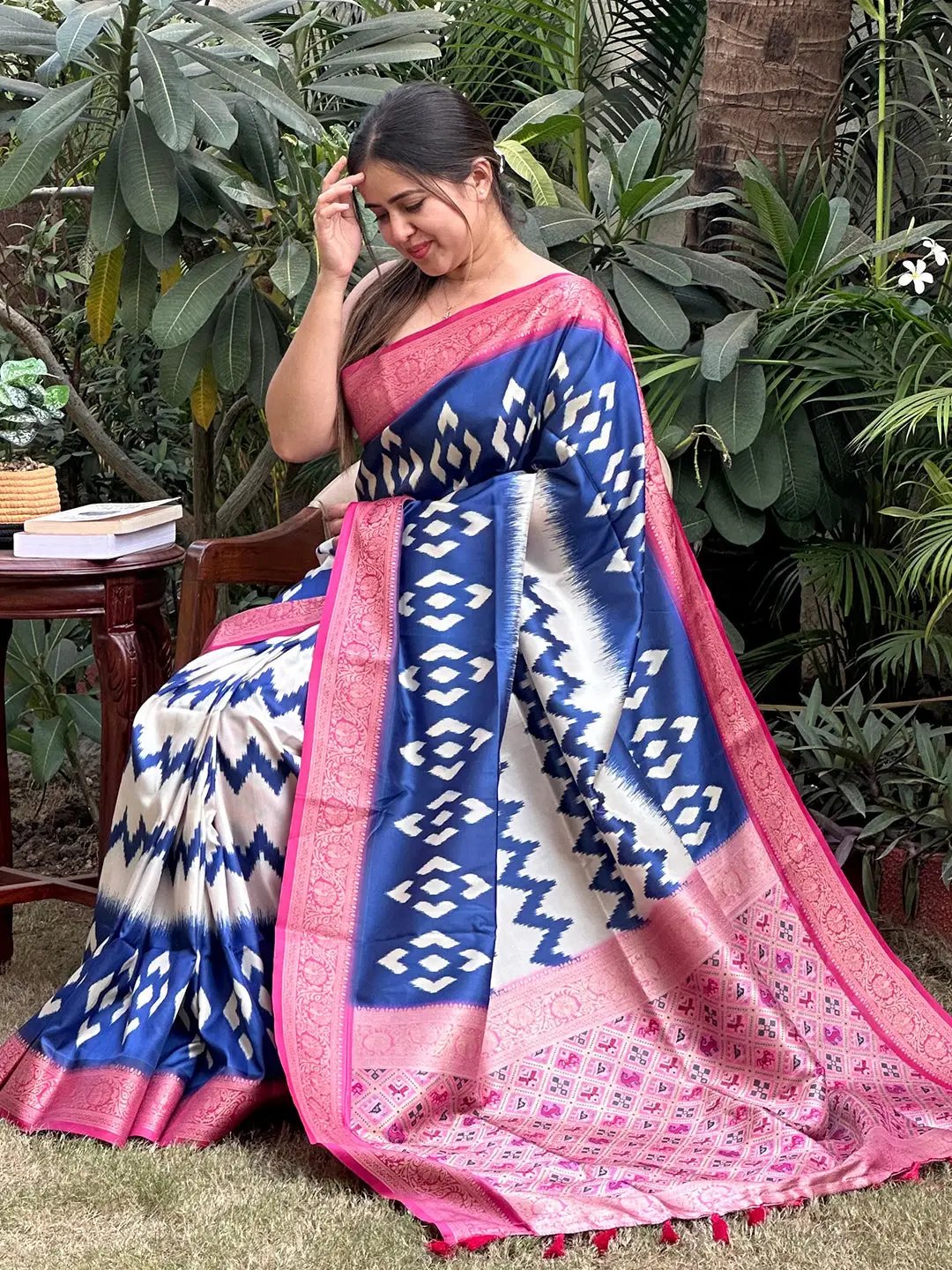 Stylish Banarasi saree adorned with blue and pink Zari Patola