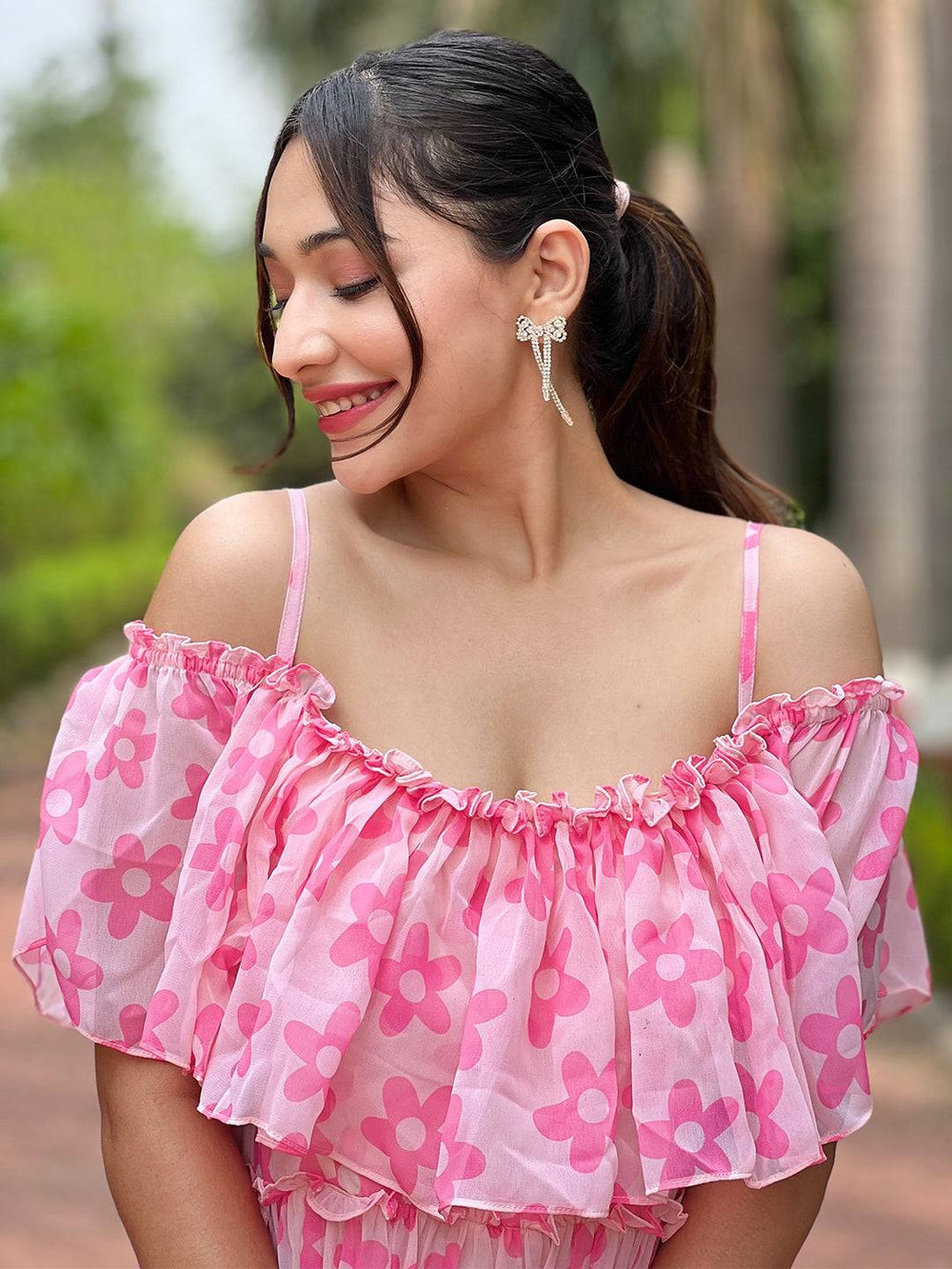 Close-up of pink floral dress with ruffle neckline