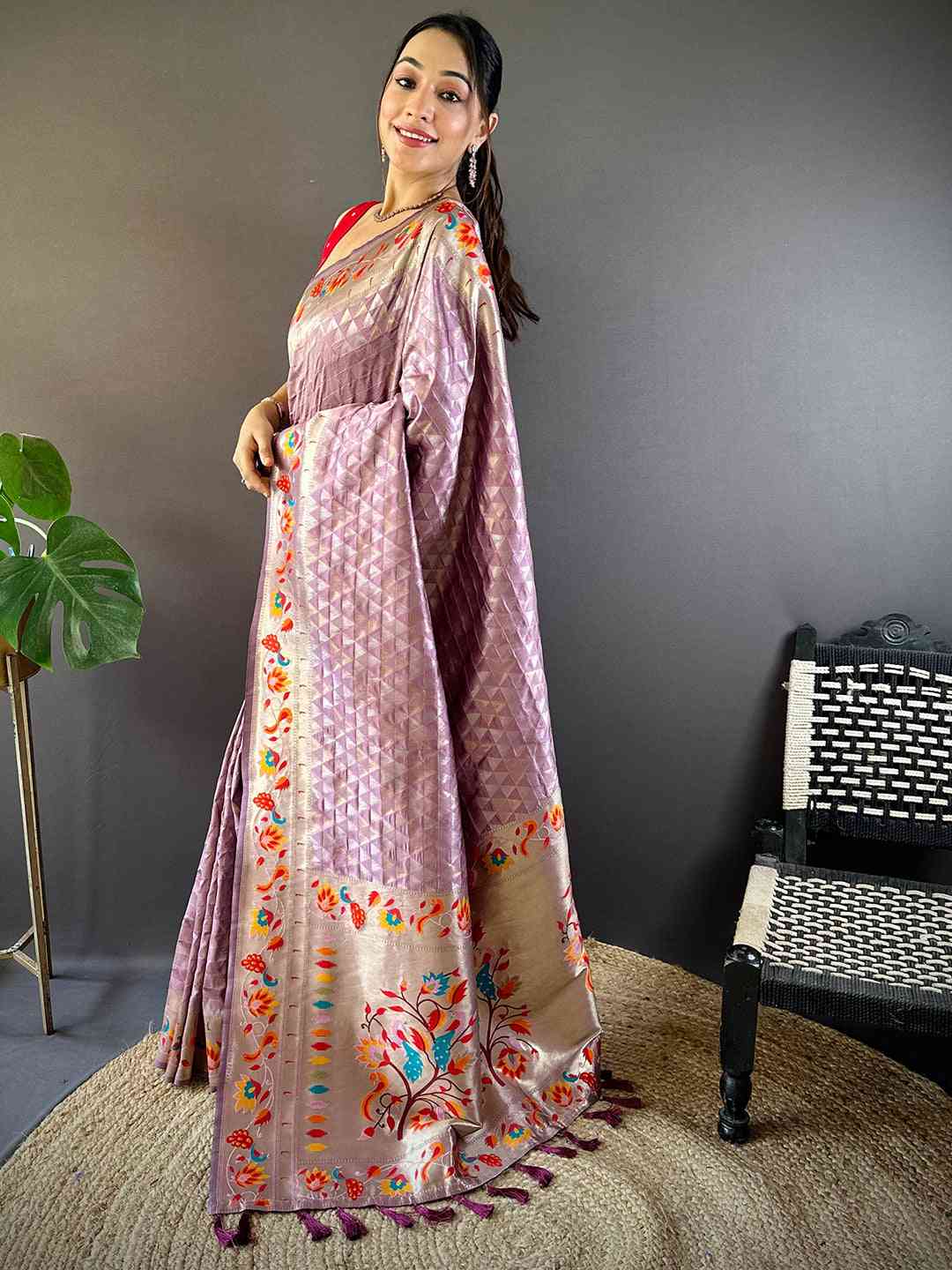 Model wearing light wine silk Paithani saree with zari work