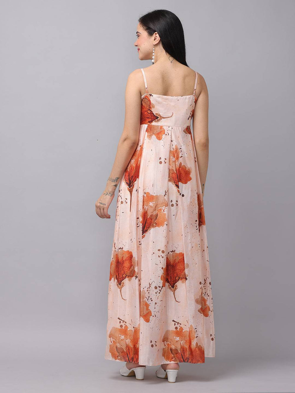Peach color corset dress with floral pattern, back view.