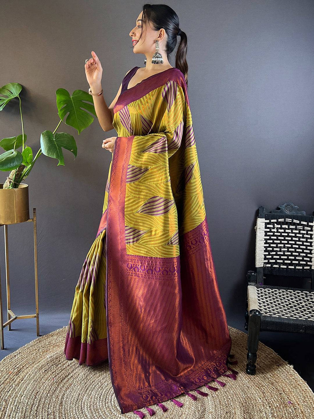 Side view of green tussar silk saree showcasing ikkat design