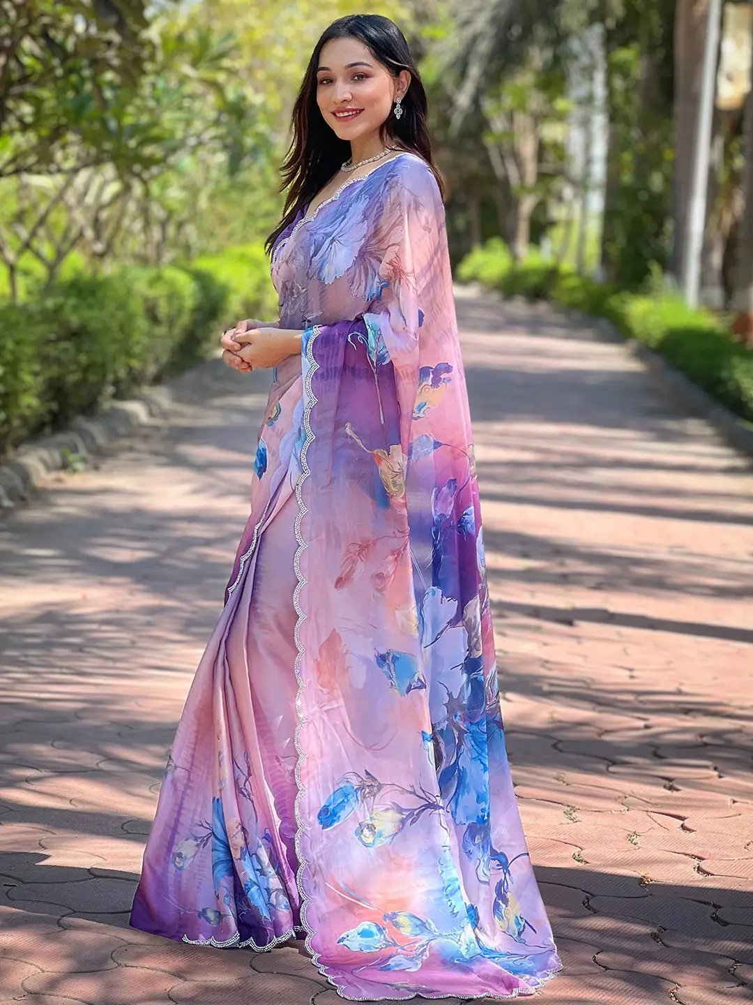 Side view of lavender satin georgette saree with floral design.