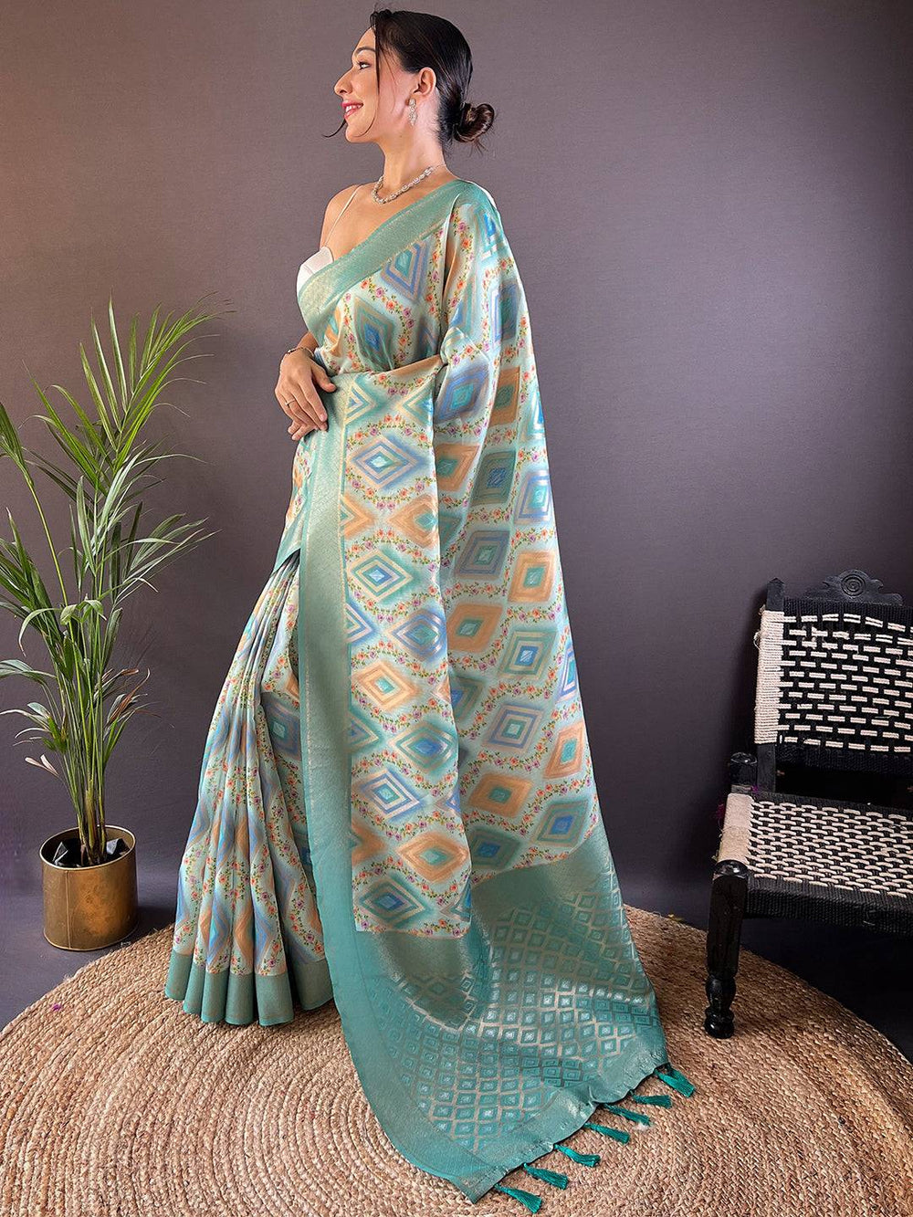 Stylish mint green saree featuring intricate patterns