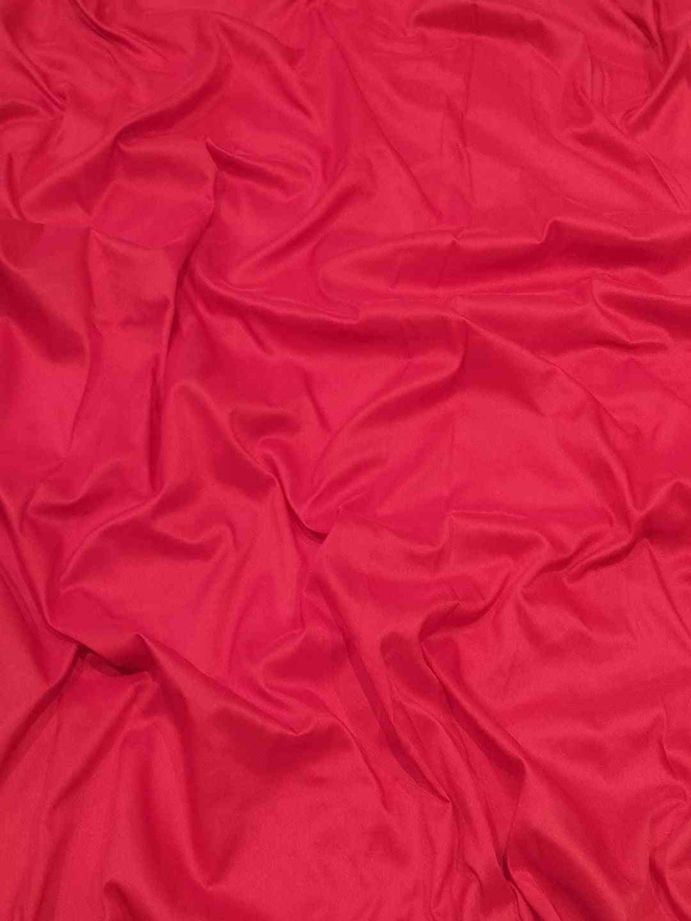 Close-up of red silk fabric texture