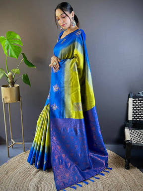 Side pose of model in blue and green silk saree