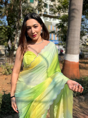 Pista satin georgette saree with intricate stone detailing