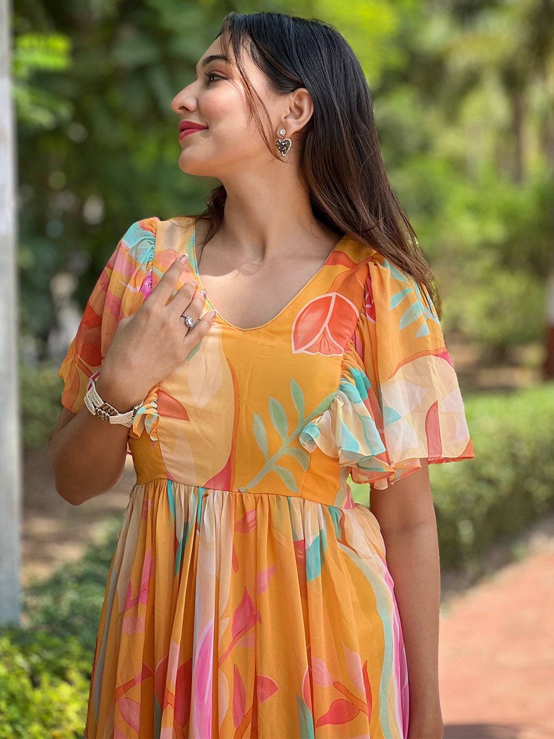 Close-up of Carnival Yellow V-Neck Dress with ruffled sleeves