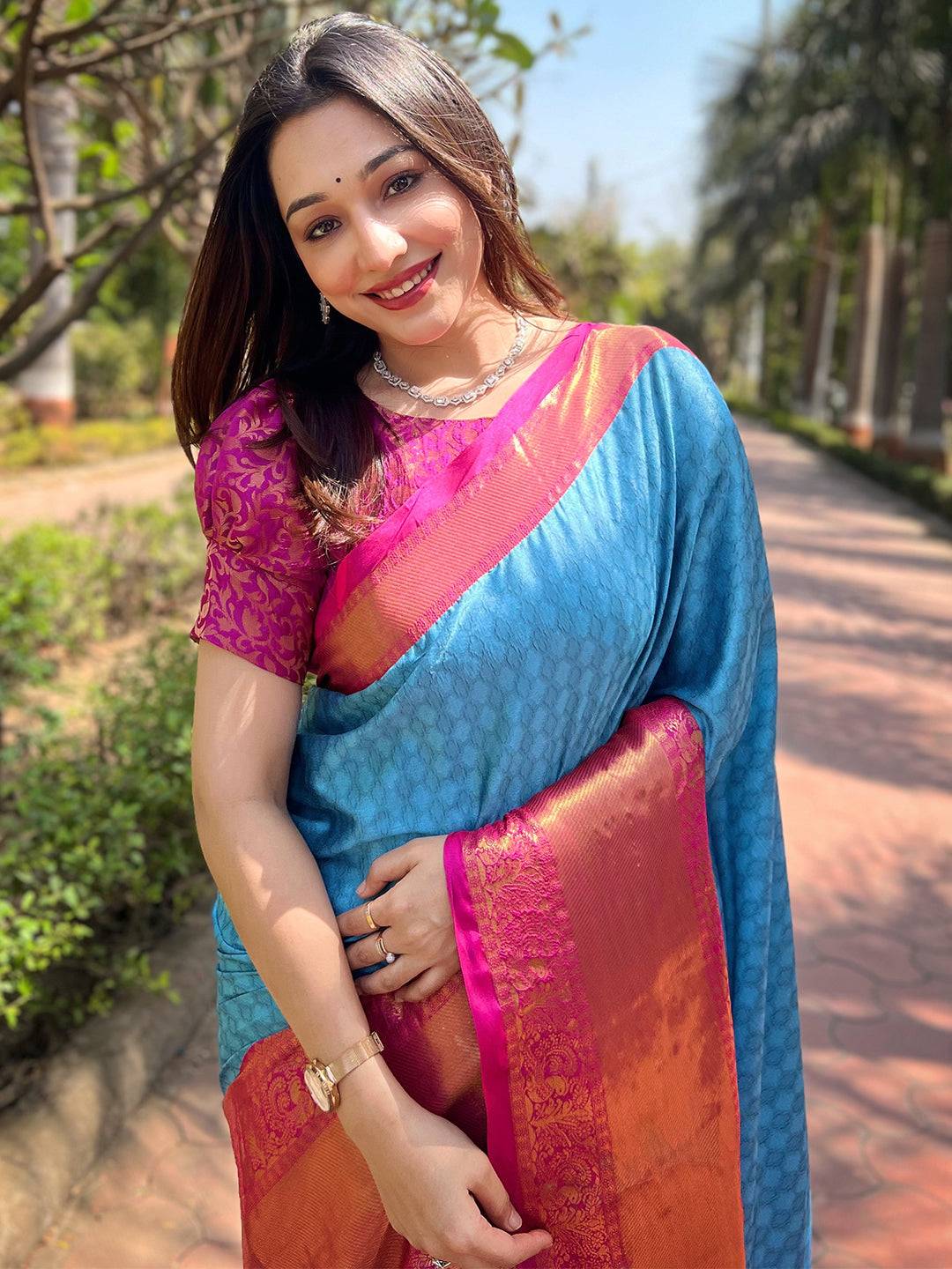 Woman in royal blue Kanjivaram silk saree with zari blouse