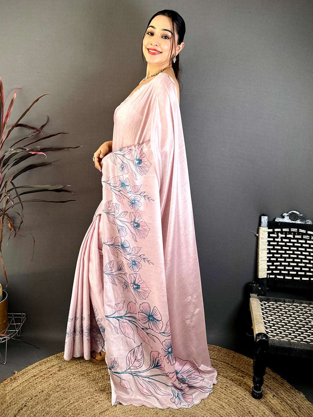 Elegant pink floral saree with embroidery and draped style for festive wear
