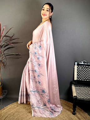 Elegant pink floral saree with embroidery and draped style for festive wear