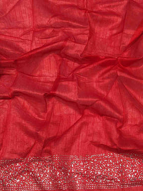 Close-up of red fabric with silver embroidered border