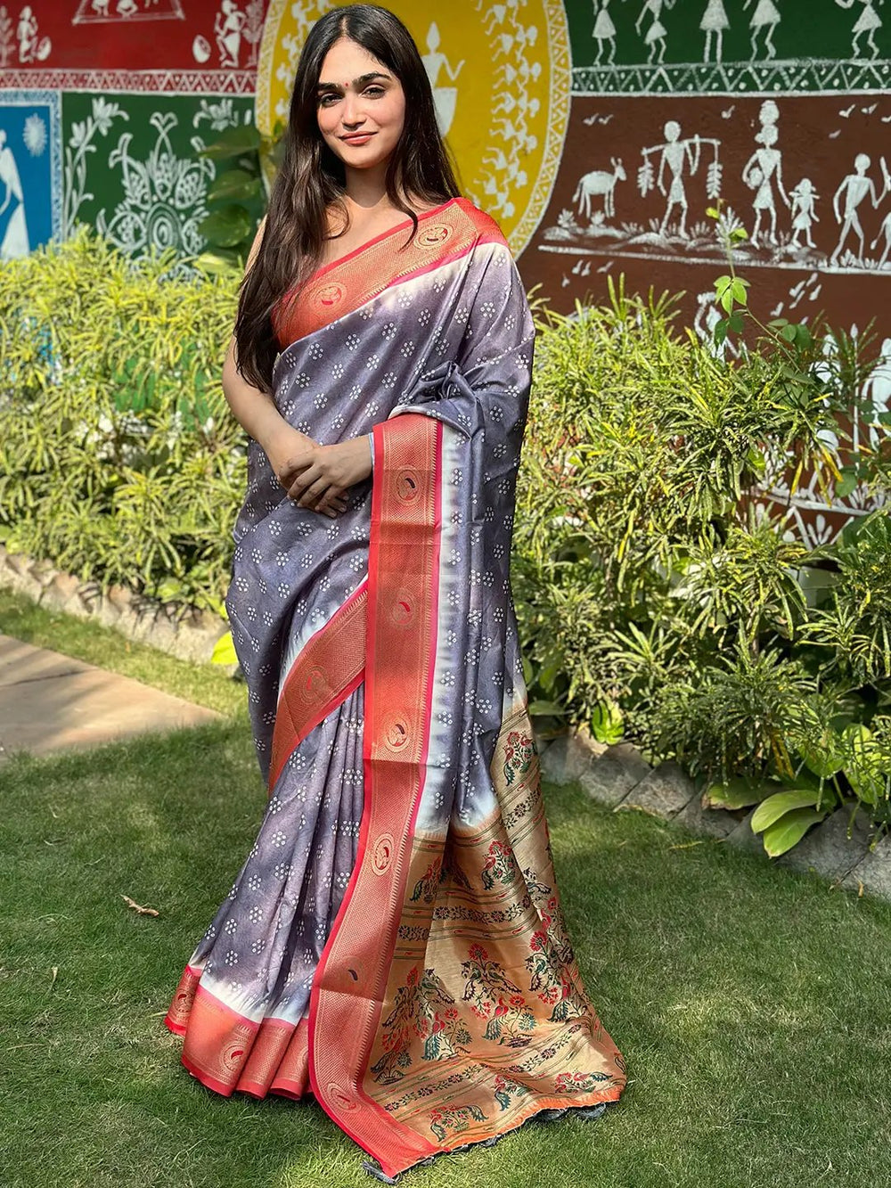 Woman in garden wearing Paithani Bandhej Print Saree