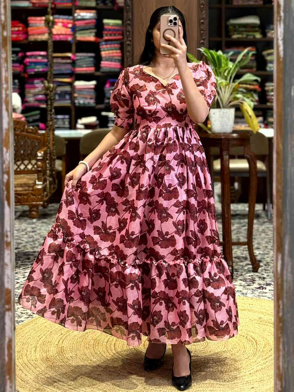 Baby Pink Floral Print Midi Dress with puff sleeves and tiered skirt, perfect for an elegant and charming look. Shop online at Vastranand.