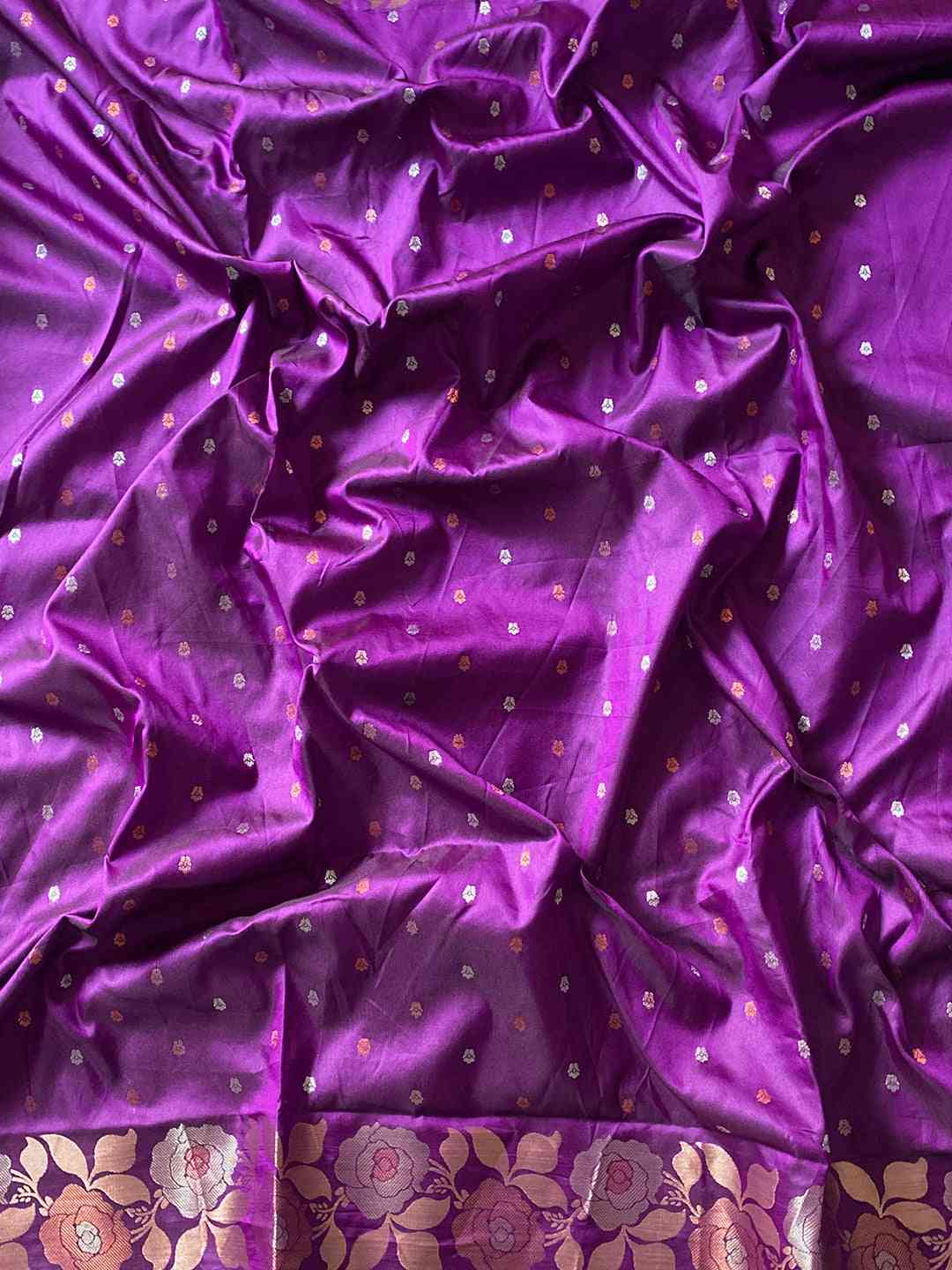 Close-up of purple Banarasi silk saree with zari border