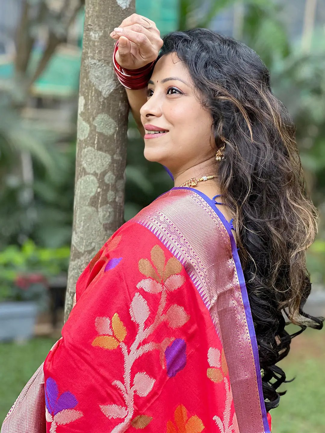 Close-up of red Banarasi saree with Minakari Ikkat work