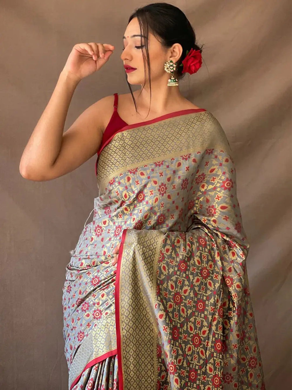 Close-up of grey Rajkoti Patola silk saree with red accents