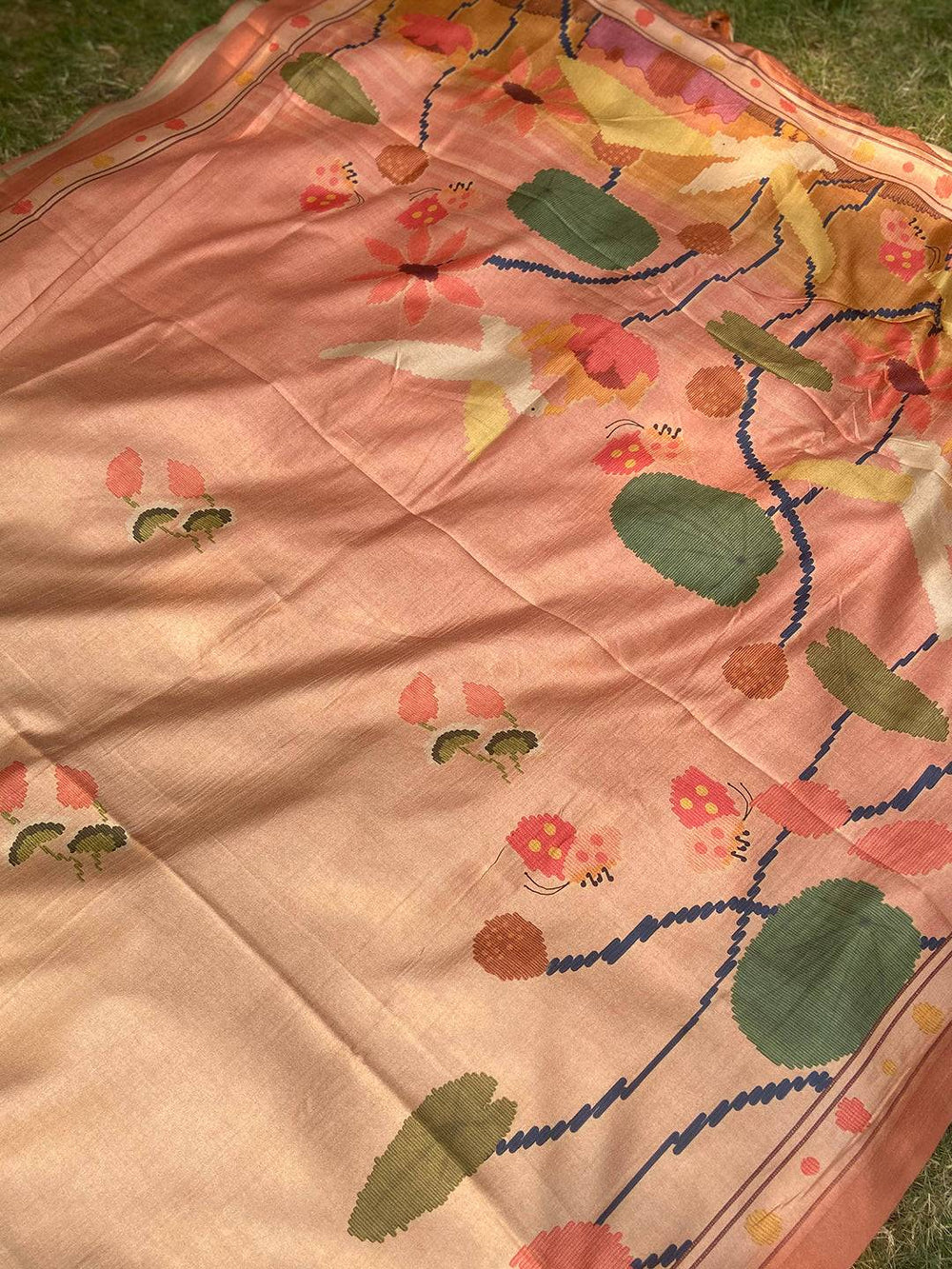 Brown Tussar Silk Saree spread out showing intricate Kalamkari print