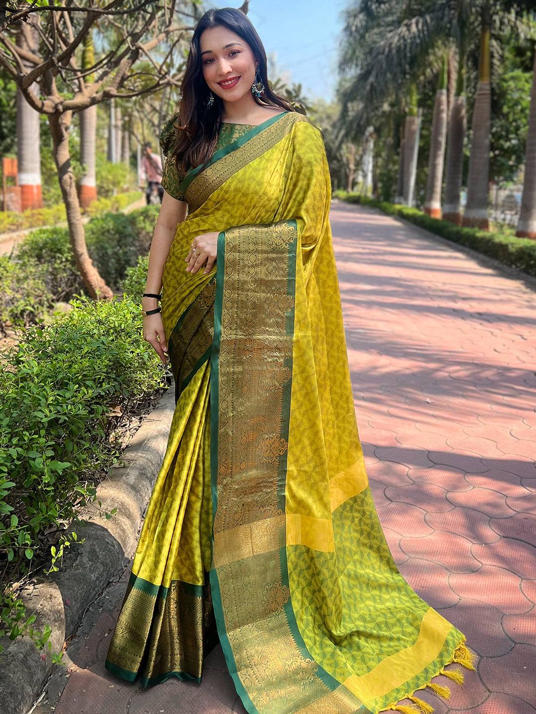 Model showcasing traditional green Kanjivaram silk saree
