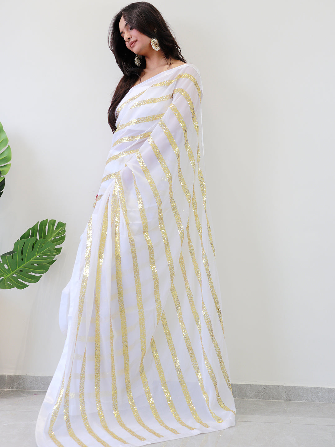 Georgette saree with shimmering gold stripes and solid border