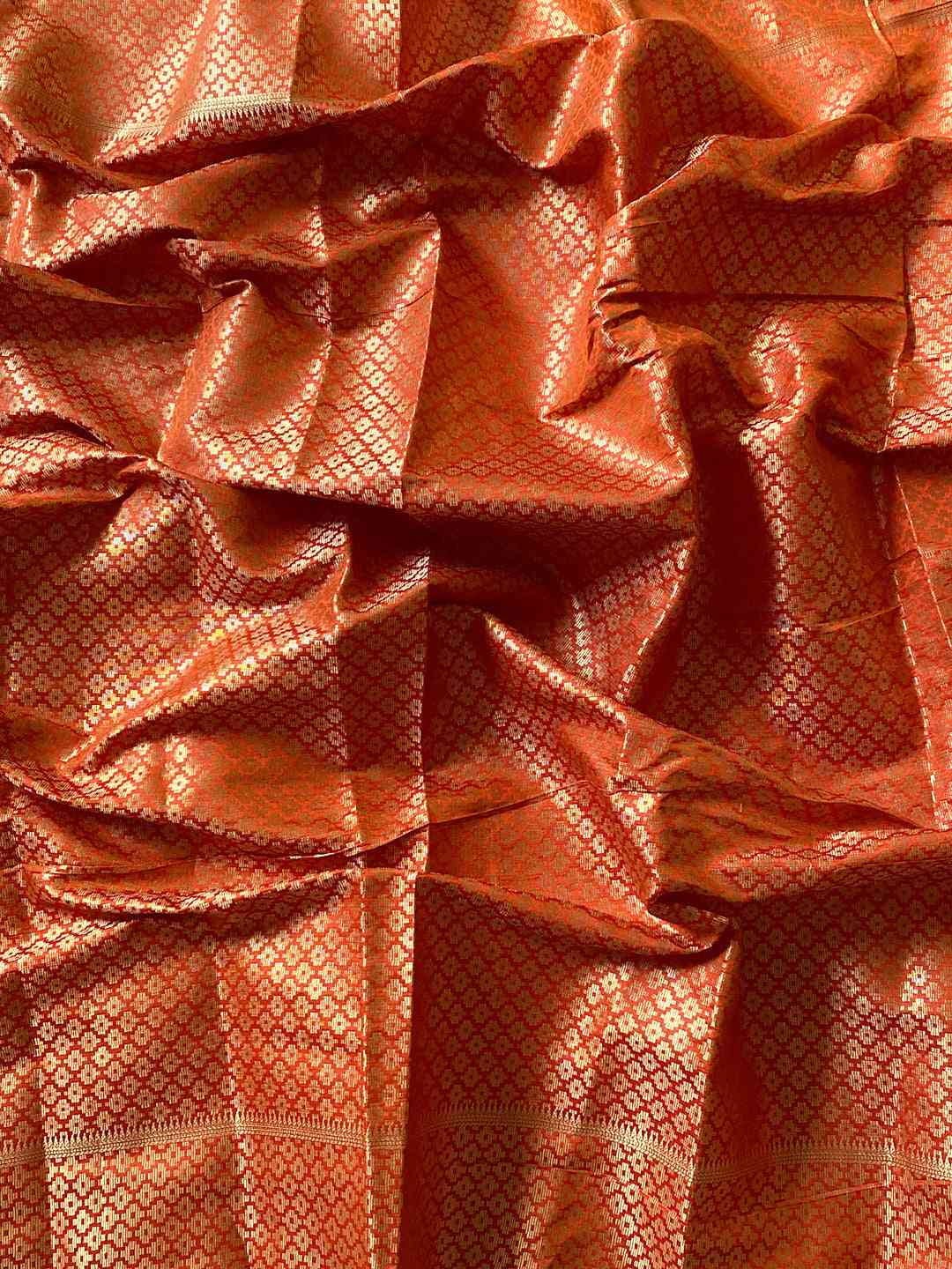 Close-up of Wine Patola Silk Saree fabric with zari