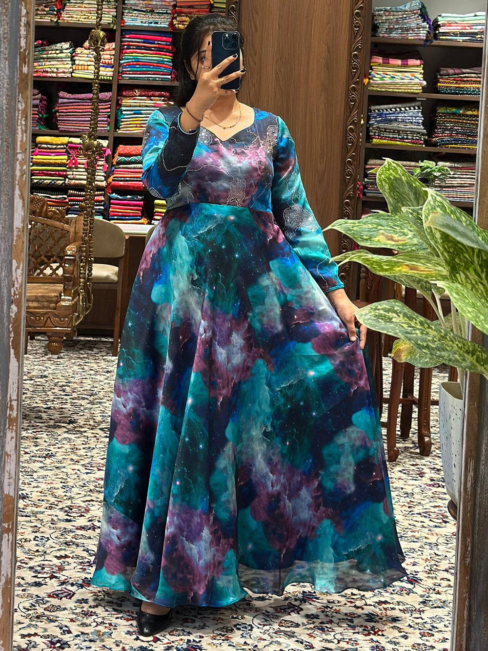 Blue Galaxy Print Dress with flowing skirt in fabric store.