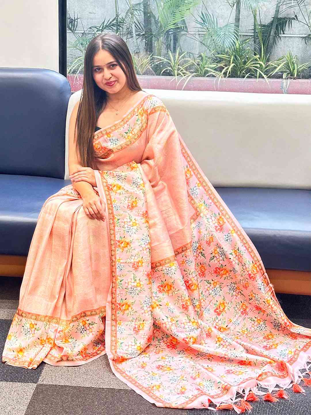 Elegant Kanjivaram saree with floral print, draped on a woman.