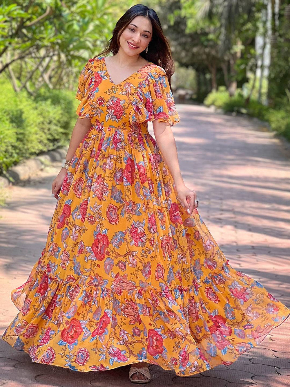 Honey Yellow Chints Flower Dress flowing outdoors