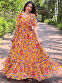 Honey Yellow Chints Flower Dress flowing outdoors