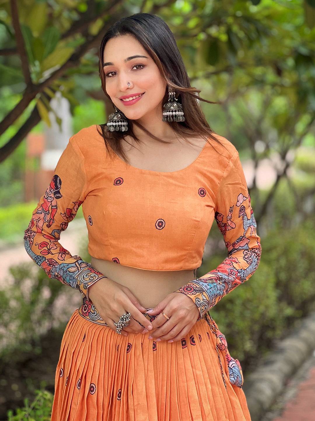 Model wearing Merigold Yellow Lehenga with earrings