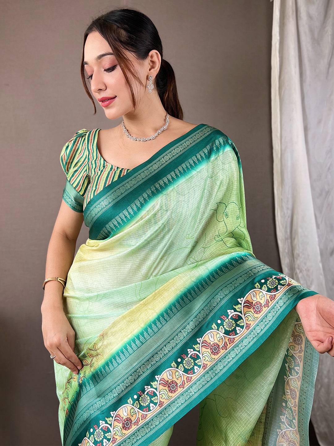 Emerald Green Kota Satin Border Saree with intricate design