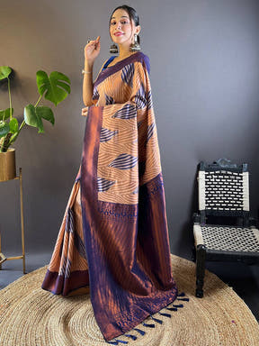 Side pose of model in Peach Tussar Silk Ikkat Saree