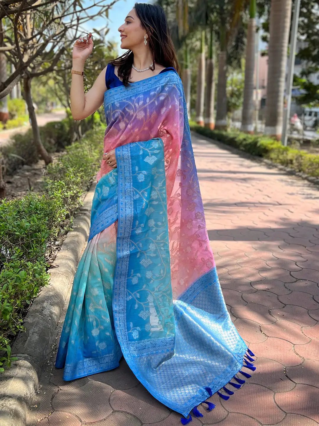 Woman showcasing stylish slub silk saree in vibrant colors