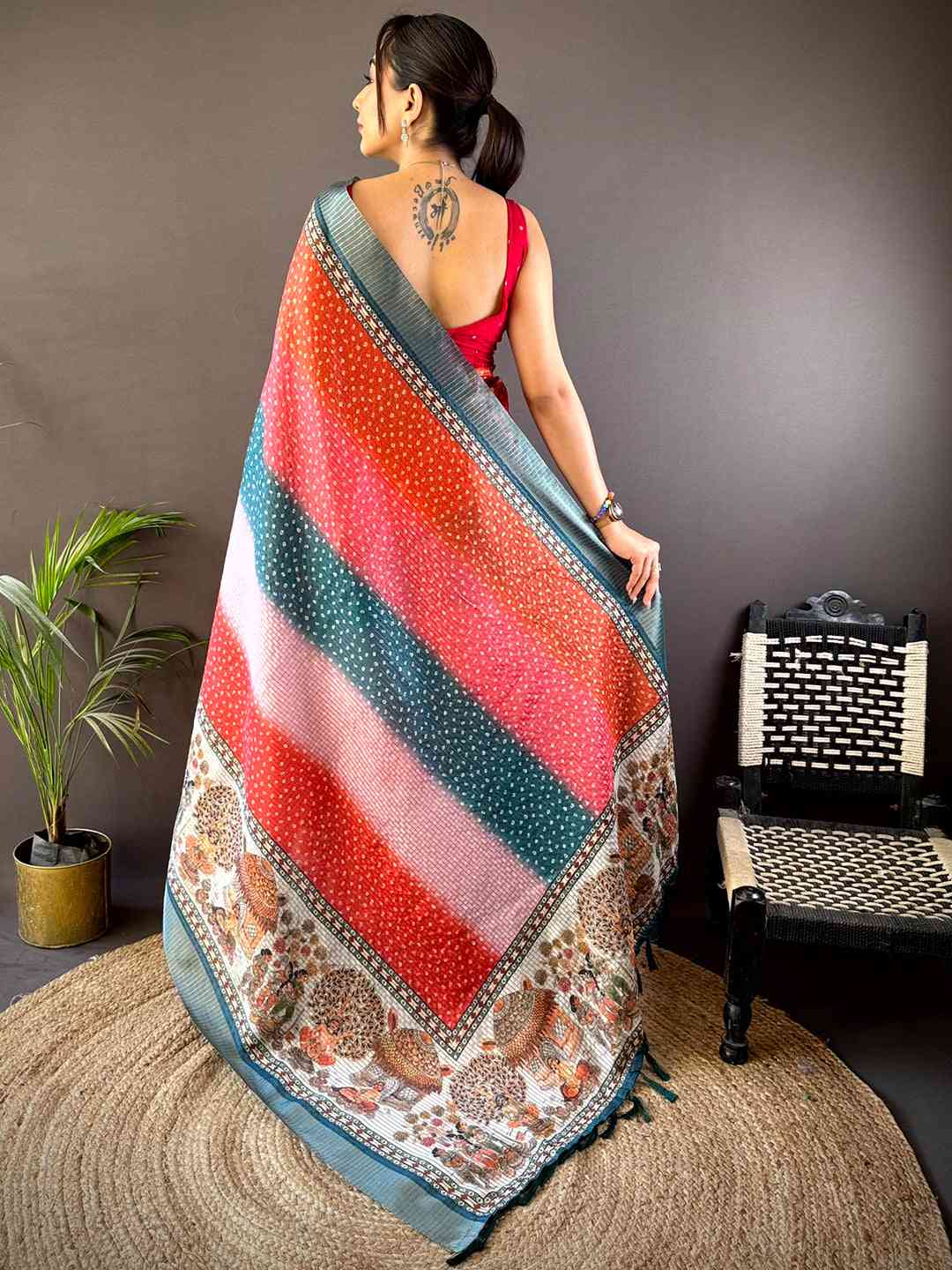 Back view of Radiant Silk Blend Bandhani Print Saree showcasing detailed prints and a graceful drape. A must-have for festive celebrations.