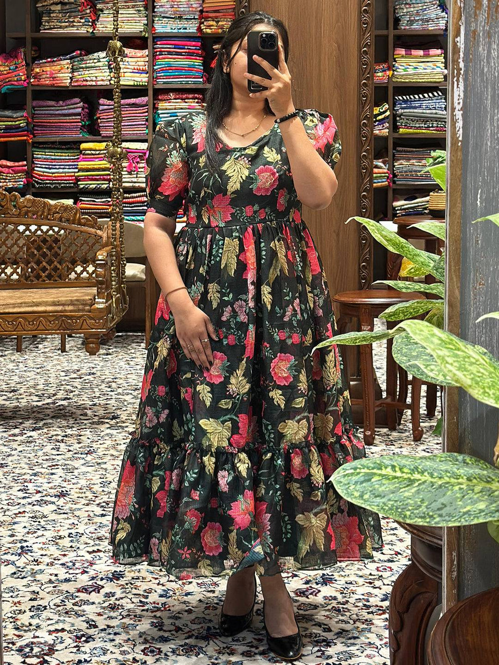 Model showcasing Revan Black Floral Print Midi Dress