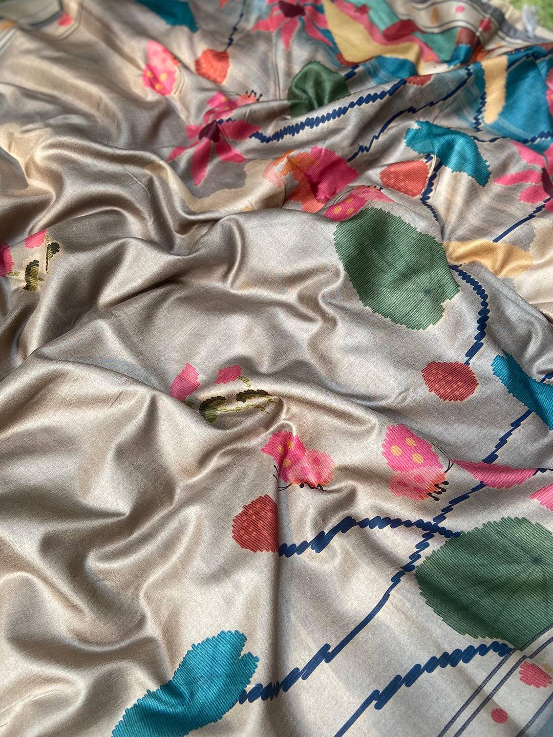 Close-up of Grey Tussar Silk Saree with vibrant Ikkat Kalamkari print