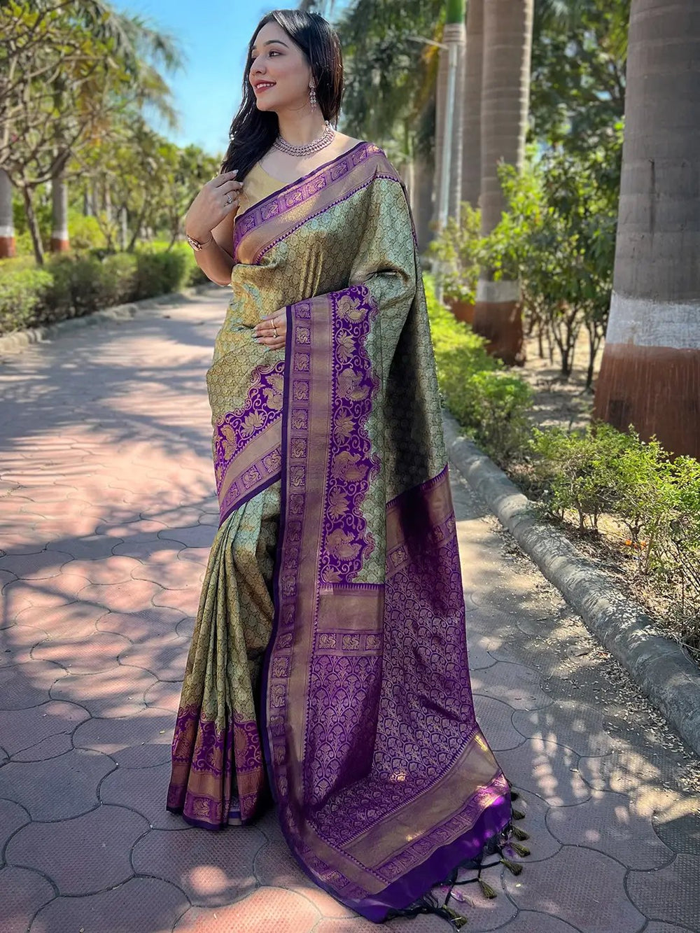 Elegant gold and purple Kanjivaram silk saree outdoors