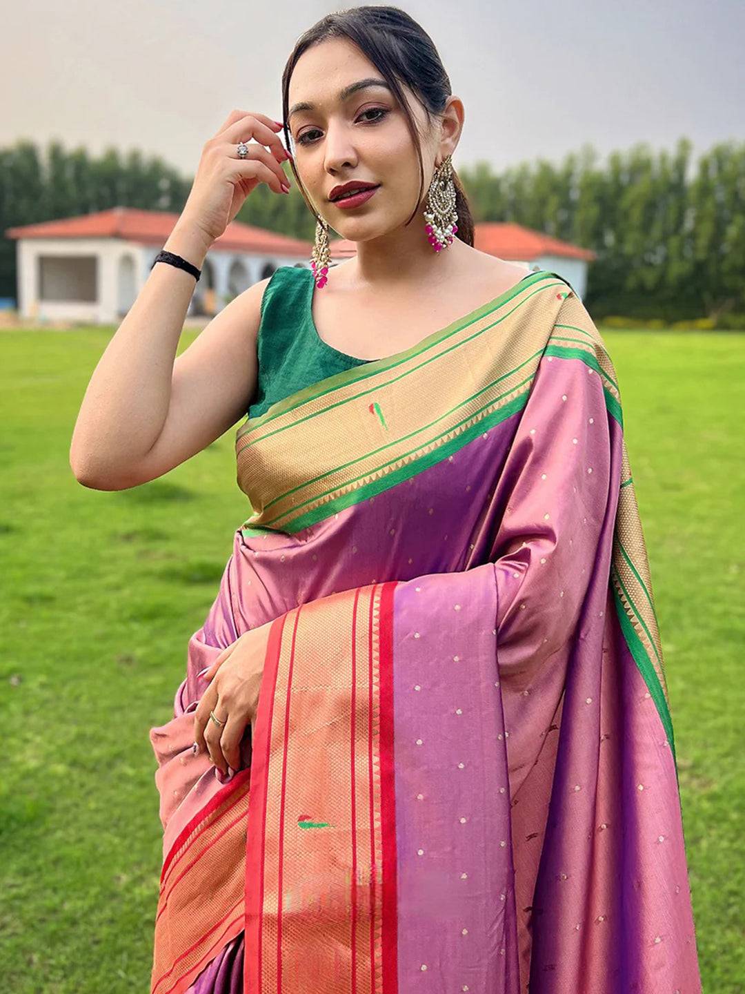 Woman wearing Pink Paithani Ganga Jamuna Broder Saree outdoors
